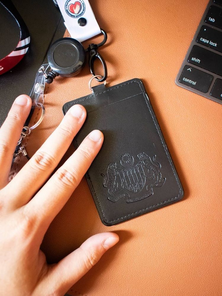 Pvc ID Card Holder Double Slot with Deboss Jata Logo Black - A complementary item to your lanyard featuring Jata Negara of Malaysia which surely elevate your identity. Made of PVC material which is known for the durability that will keep your ID card secure.